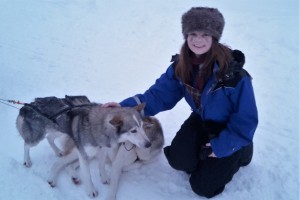Kayleigh Tanner with two huskies in Finnish Lapland